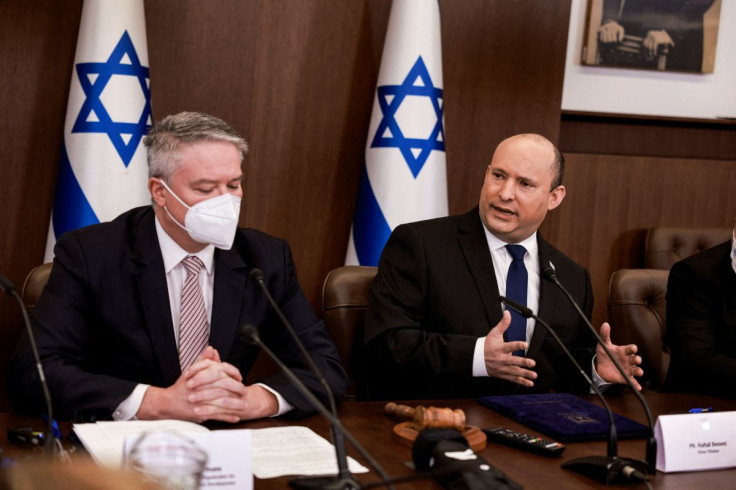 Israeli Prime Minister Naftali Bennett, accompanied by Secretary-General of the Organisation for Economic Co-operation and Development (OECD) Mathias Cormann, chairs the weekly cabinet meeting at the prime minister's office in Jerusalem February 13, 2022.