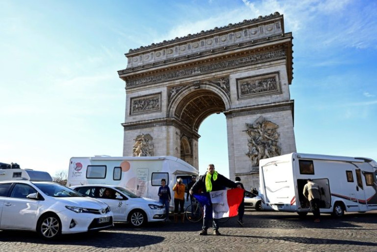 Around 100 drivers defied the protest ban to snarl traffic on the Champs-Elysees on Saturday.