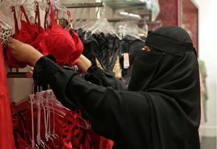 A saleswoman arranges displays in an underwear store decorated for Valentine's Day -- although it's not mentioned -- at Panorama Mall in the Saudi capital Riyadh