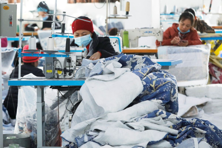 Labourers work at a private garment factory in Hanoi, Vietnam January 8, 2021.