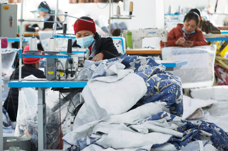 Labourers work at a private garment factory in Hanoi, Vietnam January 8, 2021. 