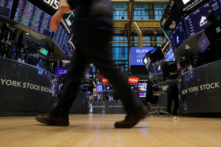 Traders work on the floor of the New York Stock Exchange (NYSE) in New York City, U.S., January 26, 2022.