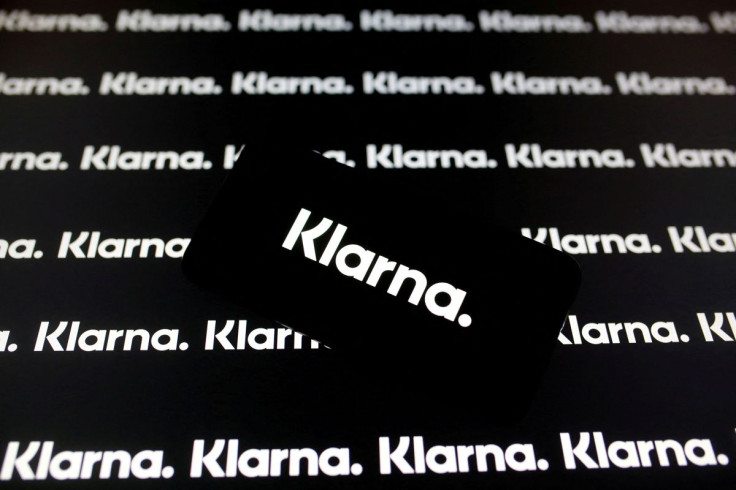 A smartphone displays a Klarna logo in this illustration