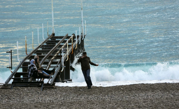 Tourists spend time at the beach in the Mediterranean resort city of Antalya, a popular destination for German tourists in Turkey, January 13, 2016.