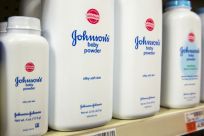 Bottles of Johnson & Johnson's baby powder line a drugstore shelf in New York October 15, 2015.  