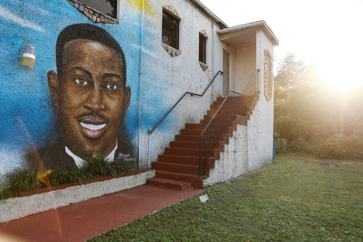 A mural of Ahmaud Arbery is painted on the side of the Brunswick African American Cultural Center in downtown Brunswick, Georgia, U.S. October 11, 2021.  