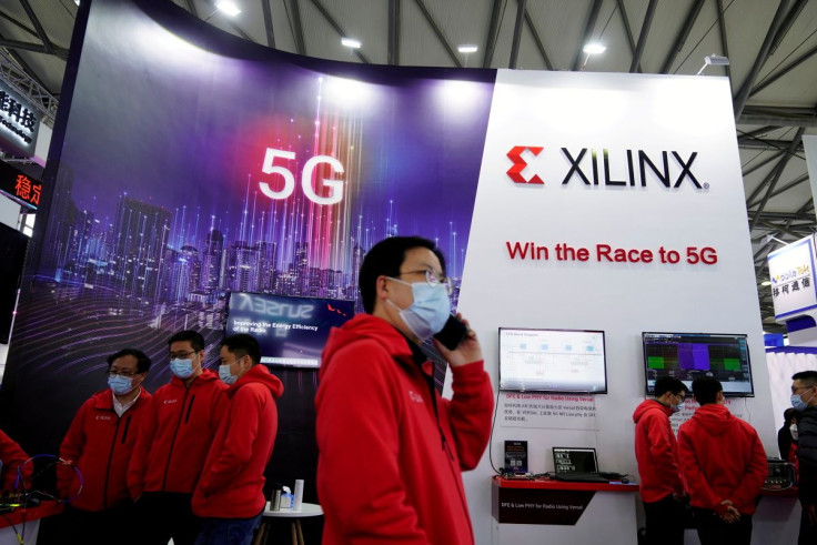 Staff members stand at a Xilinx Inc booth at the Mobile World Congress (MWC) in Shanghai, China February 23, 2021.