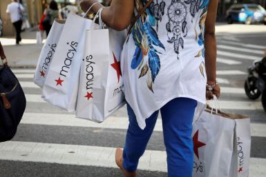 A woman carries shopping bags from Macy's department store in midtown Manhattan following the outbreak of the coronavirus disease (COVID-19) in New York City, New York, U.S., July 9, 2020. 