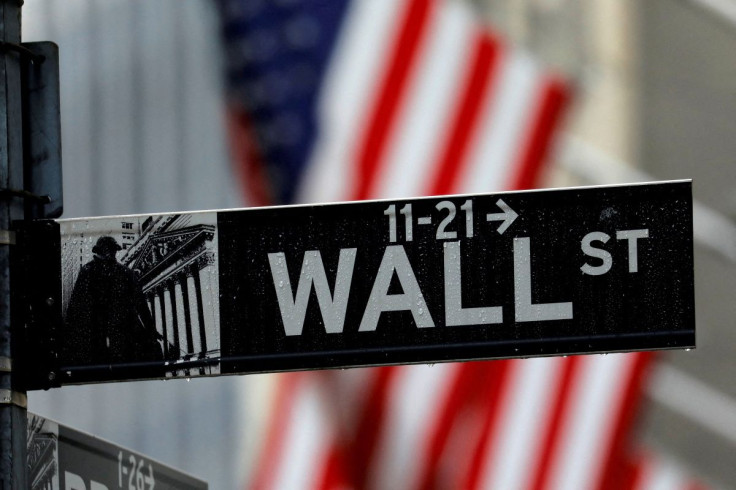 Raindrops hang on a sign for Wall Street outside the New York Stock Exchange in Manhattan in New York City, New York, U.S., October 26, 2020. 