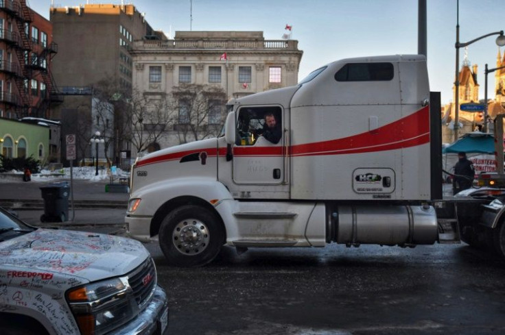 A truck departs a protest by truck drivers over pandemic health rules and the Trudeau government in Ottawa, Canada on February 14, 2022
