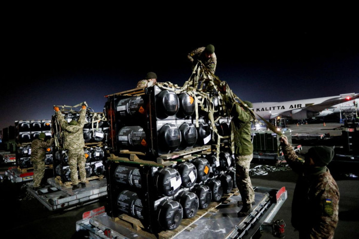 Ukrainian service members unpack Javelin anti-tank missiles, delivered by plane as part of the U.S. military support package for Ukraine, at the Boryspil International Airport outside Kyiv, Ukraine February 10, 2022. 