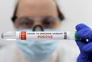 Illustration shows test tube labelled "COVID-19 Omicron variant test positive