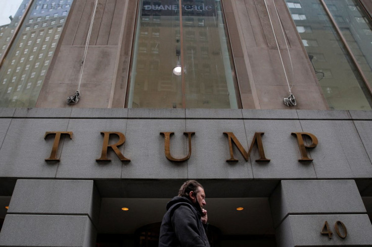 A woman walks past 40 Wall Street, also known as the Trump Building, in the Manhattan borough of New York City, New York, U.S., January 19, 2022.  