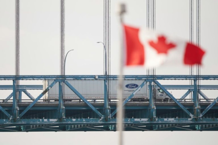 A tractor trailer drives across the Ambassador Bridge border crossing from Windsor, Ontario in Canada to Detroit, Michigan in the United States on February 14, 2022