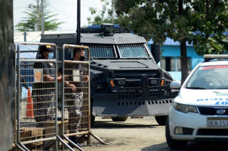 An armored vehicle leaves the Guayas #1 prison en Guayaquil, Ecuador on February 3, 2022, after authorities reported riots; Now the bodies of two men strung up in the style of Mexican cartel executioners has stunned Ecuador