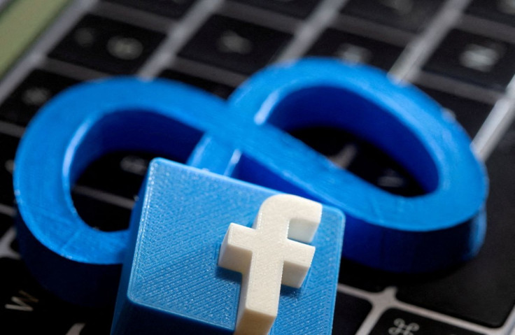 3D-printed images of logos of Facebook parent Meta Platforms and of Facebook are seen on a laptop keyboard in this illustration taken on November 2, 2021. 