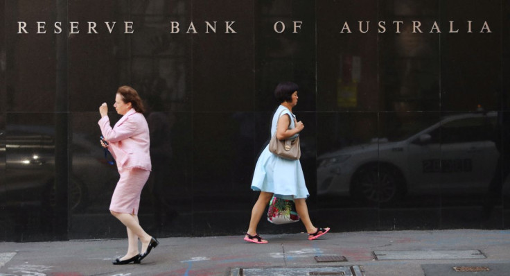 Two women walk next to the Reserve Bank of Australia headquarters in central Sydney, Australia February 6, 2018. 