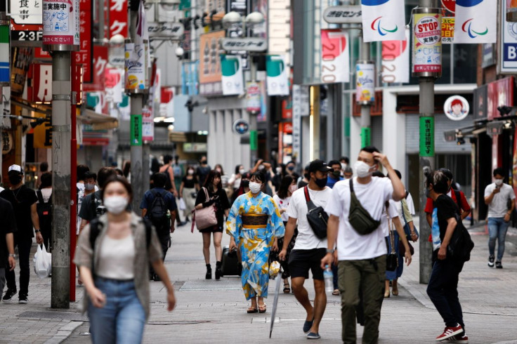 People walk in Shibuya shopping area, during a state of emergency amid the coronavirus disease (COVID-19) outbreak in Tokyo, Japan August 29, 2021.