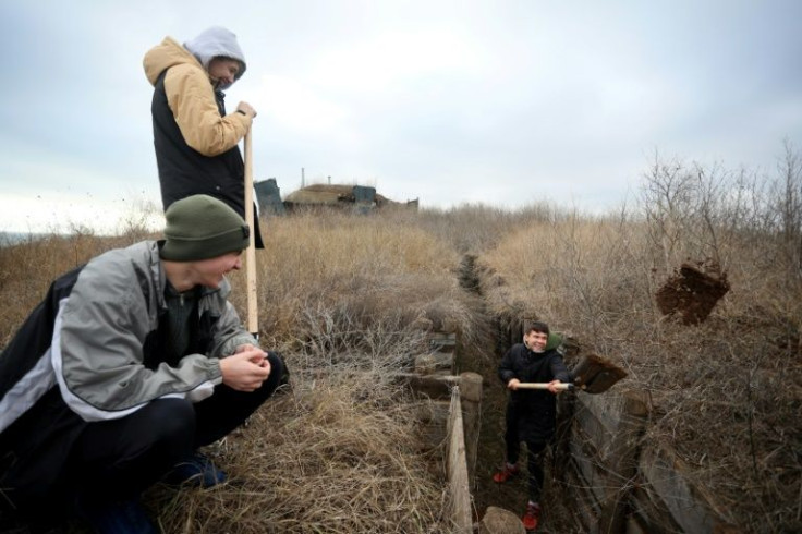 Ukrainian teenagers dig trenches for soldiers serving on their country's eastern front