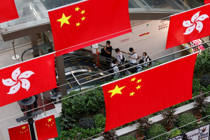 Chinese and Hong Kong flags are pictured outside a mall, ahead of the Chinese National Day, in Hong Kong, China. September 28, 2021.