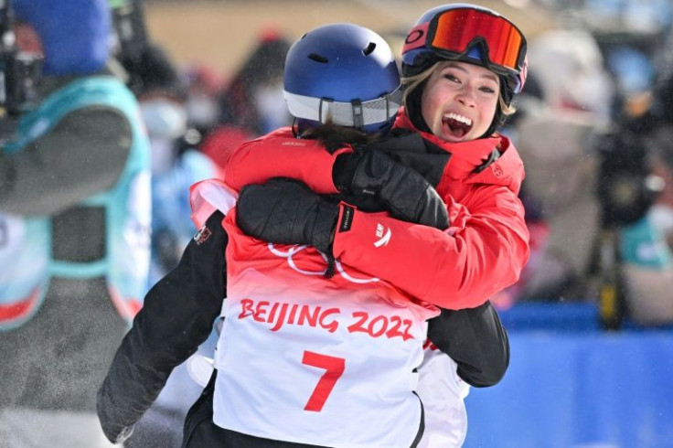 China's Eileen Gu (R) hugs winner Switzerland's Mathilde Gremaud