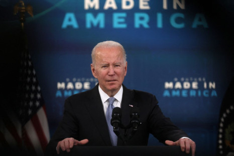 U.S. President Joe Biden is framed by TV equipment as he speaks about his economic plan and his administrationâs efforts to rebuild manufacturing, in the Eisenhower Executive Office Building's South Court Auditorium at the White House in Washington, U.S