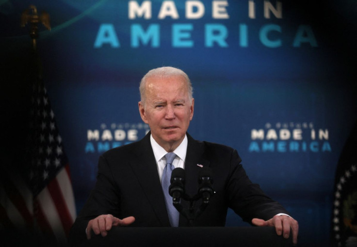 U.S. President Joe Biden is framed by TV equipment as he speaks about his economic plan and his administrationâs efforts to rebuild manufacturing, in the Eisenhower Executive Office Building's South Court Auditorium at the White House in Washington, U.S