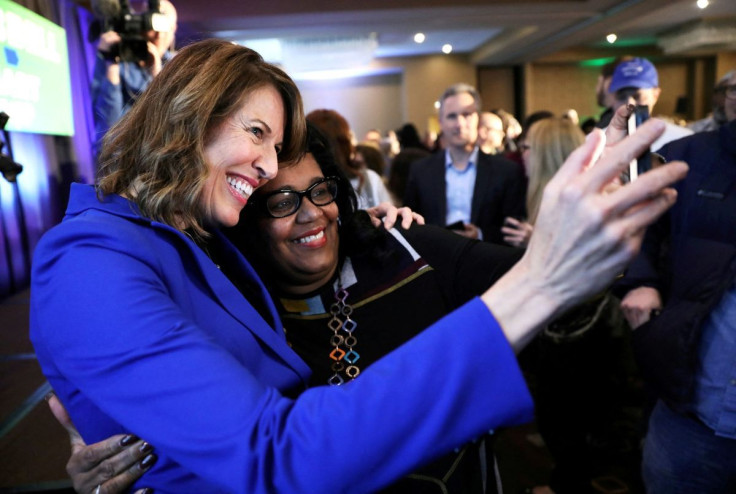 Democratic congressional candidate Cindy Axne (left) takes a photo with West Des Moines City Councilwoman Renee Hardman while appearing at her midterm election night party in Des Moines, Iowa, U.S. November 6, 2018. 