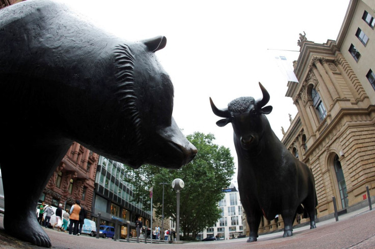 Bull and bear statues stand outside Frankfurt's stock exchange July 2, 2012. Picture taken with a fish-eye lens.  