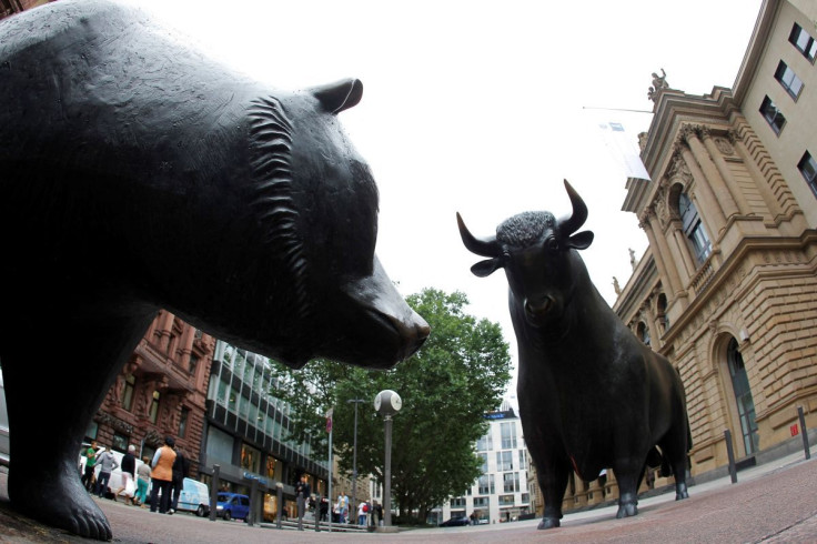 Bull and bear statues stand outside Frankfurt's stock exchange July 2, 2012. Picture taken with a fish-eye lens.
