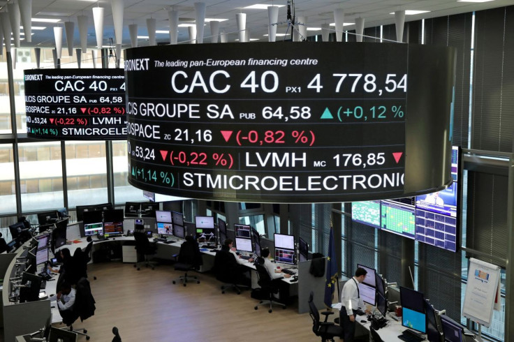 Stock index price for France's CAC 40 and company stock price information are displayed on screens as they hang above the Paris stock exchange, operated by Euronext NV, in La Defense business district in Paris, France, December 14, 2016. 