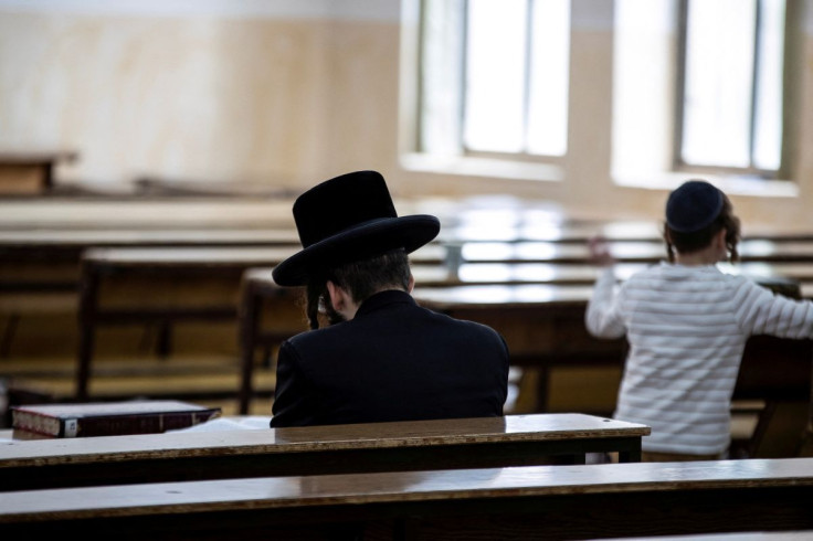 An Ultra Orthodox Jewish man sits in a religious study room in Jerusalem July 25, 2021.  