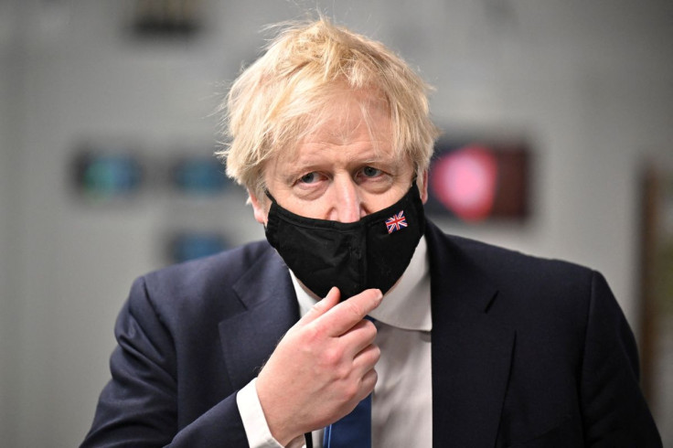British Prime Minister Boris Johnson visits the ACF building at the Technopole, Bush Estate, in Edinburgh, Scotland, Britain, February 14, 2022. Jeff J Mitchell/Pool via