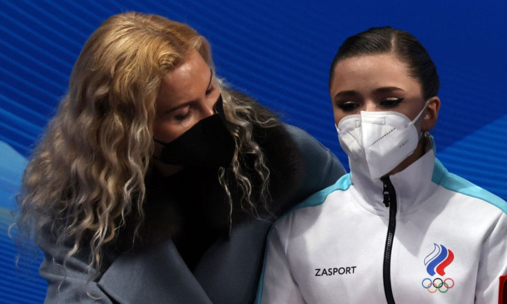2022 Beijing Olympics - Figure Skating - Women Single Skating - Short Program - Capital Indoor Stadium, Beijing, China - February 15, 2022. Kamila Valieva of the Russian Olympic Committee reacts with coach Eteri Tutberidze after competing.