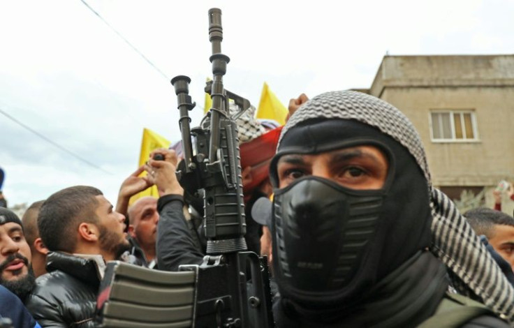 A member of the Fatah movement attends the funeral on February 14, 2022 for Palestinian teenager Mohammed Abu Salah, 17, killed after Israeli forces entered a village near the flashpoint town of Jenin in the occupied West Bank