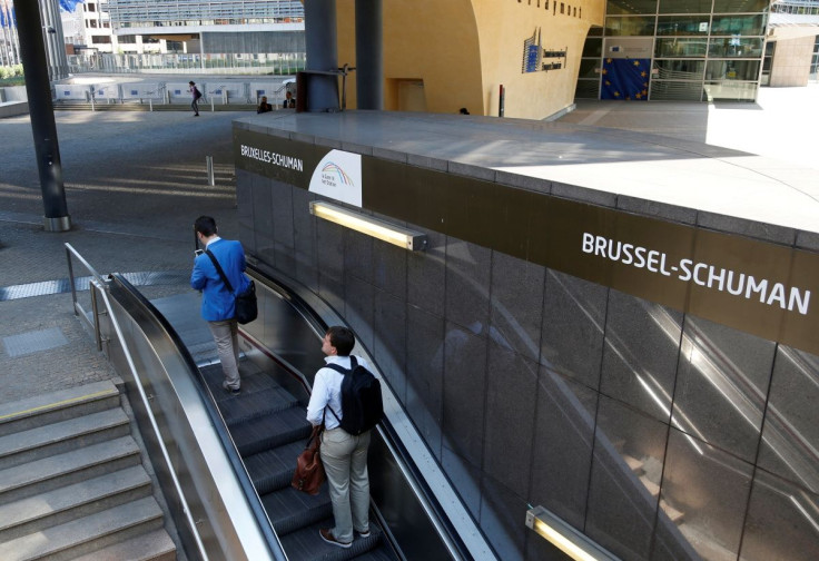 Commuters exit Brussels-Schuman underground station in front of the European Commission headquarters in Brussels, Belgium June 14, 2017.