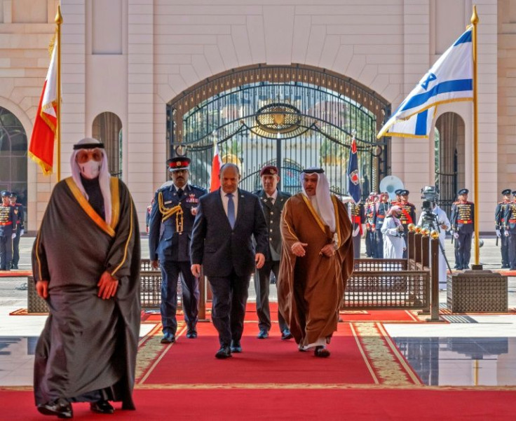 Israeli Prime Minister Naftali Bennett walking alongside Bahrain's Crown Prince Salman bin Hamad Al-Khalifa, in the capital Manama, on February 15, 2022