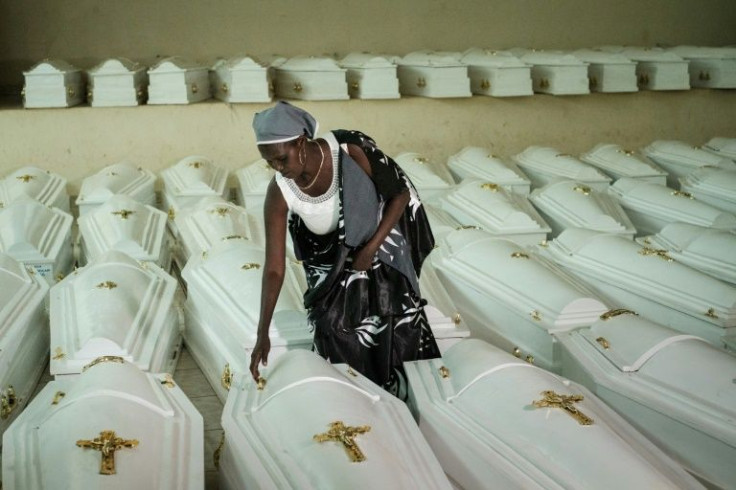 A survivor of the genocide, pictured in Kigali before a mass burial of victims in 2019