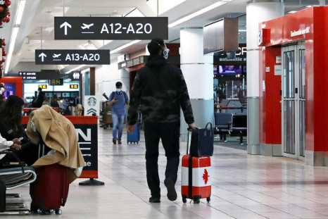 A United States-bound passenger walks in Toronto Pearson Airport's Terminal 3, days before new coronavirus disease (COVID-19) testing protocols to enter the U.S. come into effect, in Toronto, Ontario, Canada December 3, 2021.  