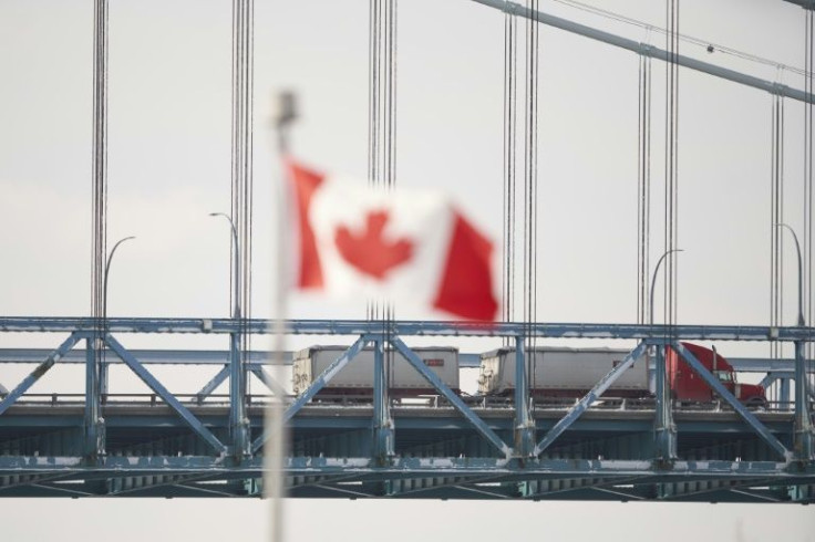 Truck traffic has resumed across the Ambassador Bridge border crossing from Windsor, Ontario, to Detroit, Michigan after police cleared protesters