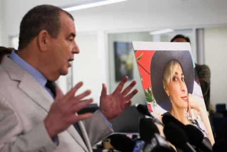 Brian Panish, lead attorney for late cinematographer Halyna Hutchins speaks to media next to her picture, in Los Angeles, California, U.S., February 15, 2022. 