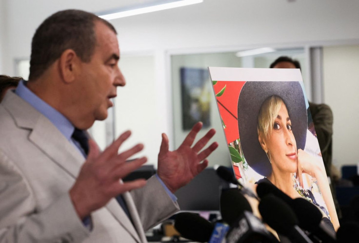 Brian Panish, lead attorney for late cinematographer Halyna Hutchins speaks to media next to her picture, in Los Angeles, California, U.S., February 15, 2022. 