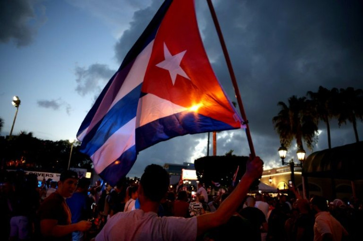 Protesters in Florida march in support of demonstrations in Cuba against economic hardships and rights violations July 11, 2021