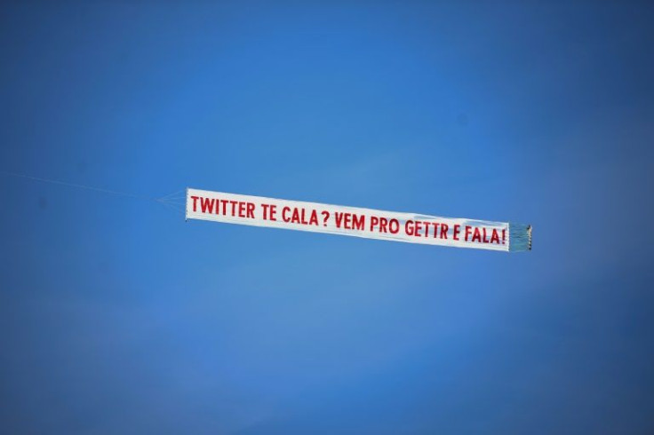 A small plane carries a banner that reads "Twitter shuts you up? Come to GETTR and talk", in promotion of the US social media company targeted to conservative voters founded by Jason Miller, a former Donal Trump aide and spokesman, during a demonstration