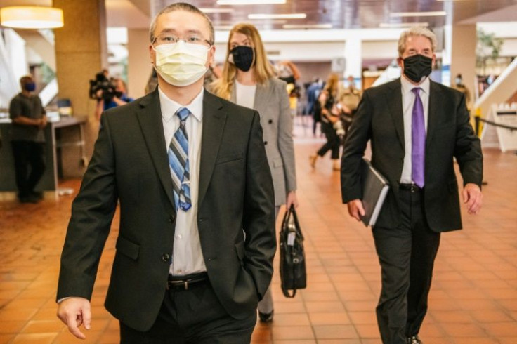 Former Minneapolis police officer Tou Thao (L) arriving for a court hearing