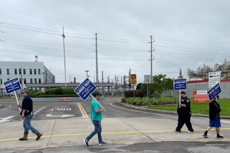 United Steelworkers (USW) union members picket outside Exxon Mobil's oil refinery amid a contract dispute in Beaumont, Texas, U.S., May 1, 2021. Exxon locked out the plant's about 650 union-represented employees citing fears of a strike. 