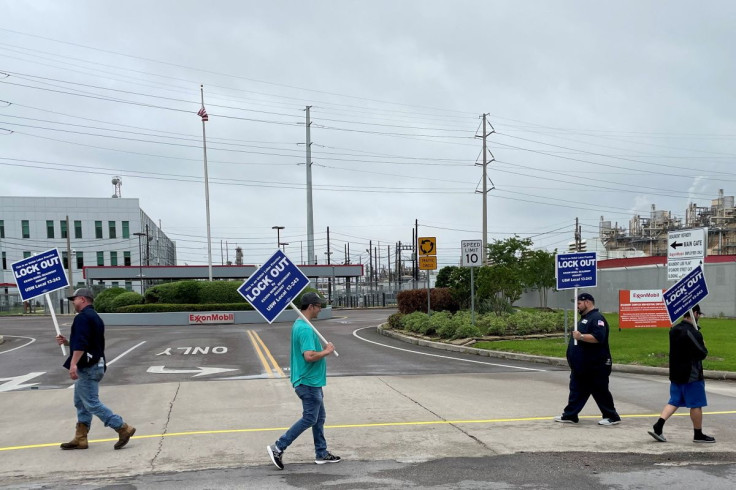 United Steelworkers (USW) union members picket outside Exxon Mobil's oil refinery amid a contract dispute in Beaumont, Texas, U.S., May 1, 2021. Exxon locked out the plant's about 650 union-represented employees citing fears of a strike.