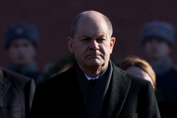 German Chancellor Olaf Scholz looks on as he attends a wreath-laying ceremony at the Tomb of the Unknown Soldier by the Kremlin Wall in Moscow, Russia February 15, 2022.