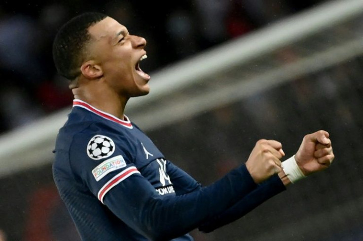 Kylian Mbappe celebrates after scoring PSG's late winner against Real Madrid