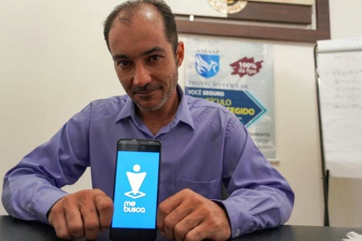 Eduardo Lima, president of the Association of Application Drivers of Sao Paulo, shows the transport app "Me Busca" (rough translation: Pick Me Up), which he and other Brazilian ride-share drivers hope can compete with industry giants like Uber